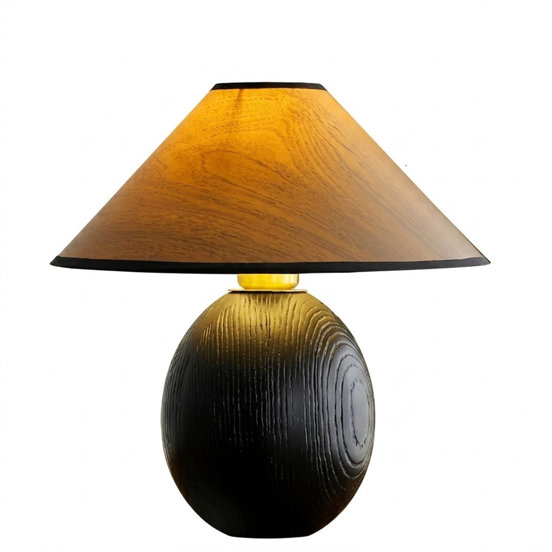 Penna wood table lamp switched on warm light glow bedside nightstand