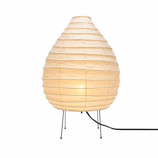 Studio portrait of the warmly glowing onion-shaped Akari 22N Table Lamp on a white backdrop by Stuber Lighting.