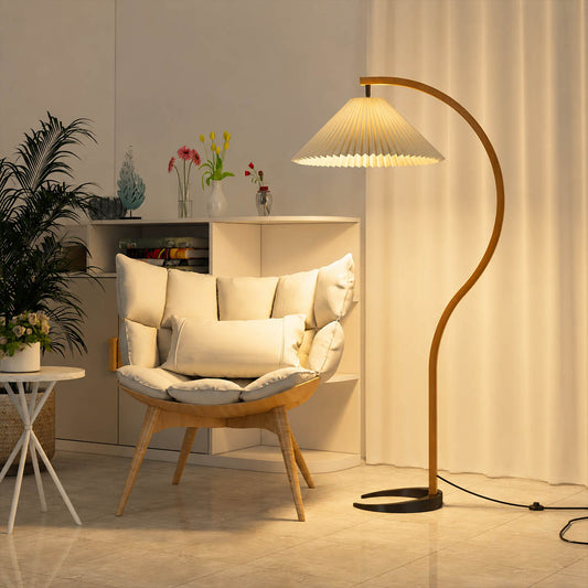 Bendik floor lamp beech wood beige linen shade reading corner armchair book cozy Scandinavian modern warm ambient sculptural Danish lifestyle interior