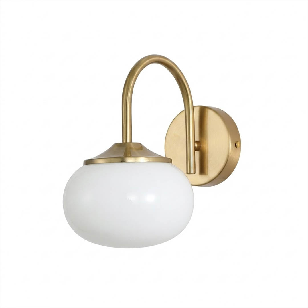 Bonbon wall sconce antique brass bow white glass globe vintage white background