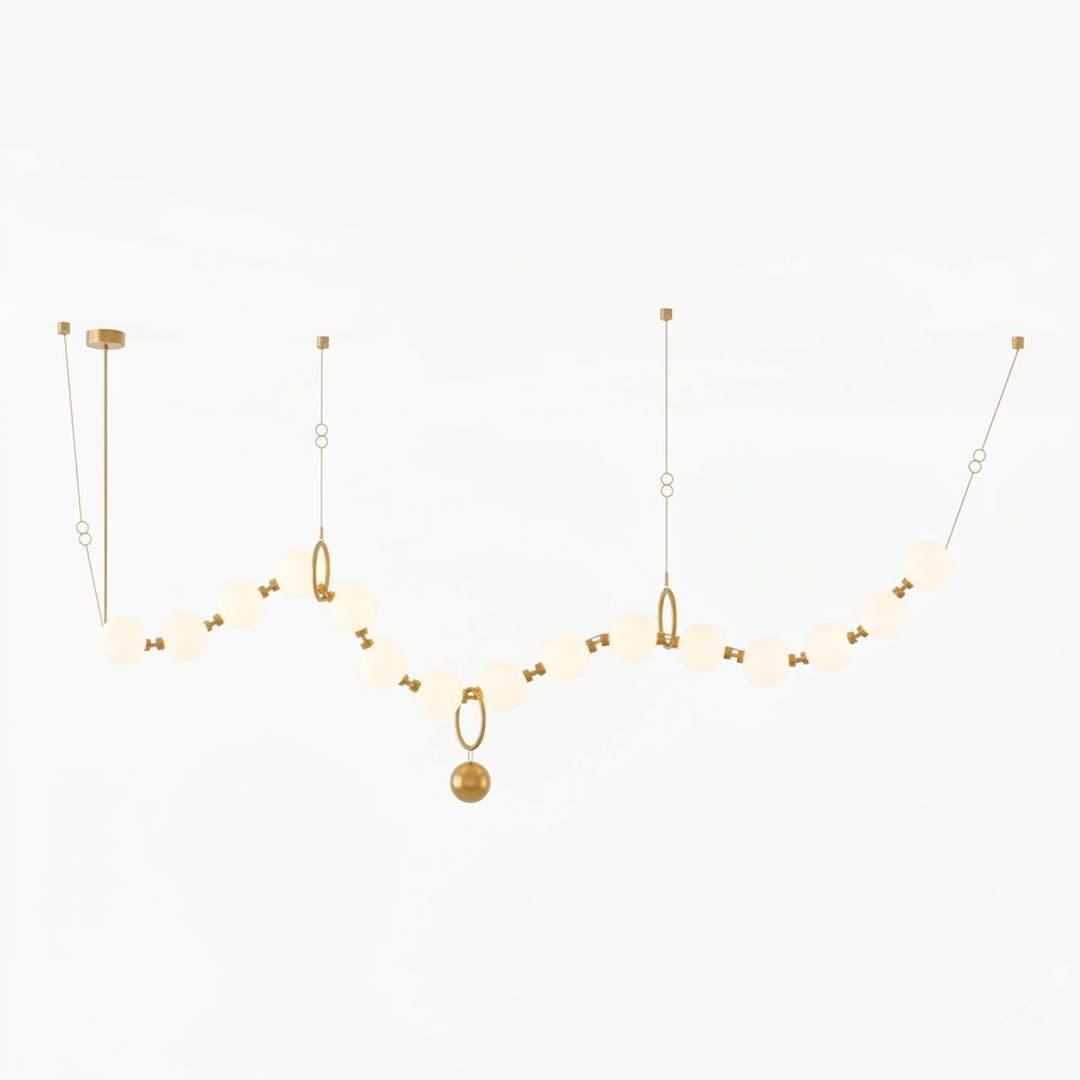 Cascadia linear horizontal chandelier 15-light brass arc pearl globes white background