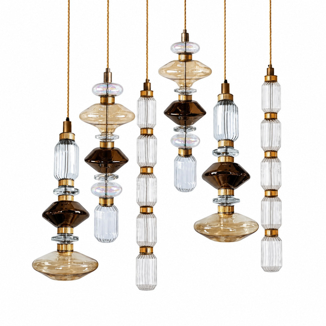 Six-head Danza glass pendant cluster on a long canopy over a kitchen island
