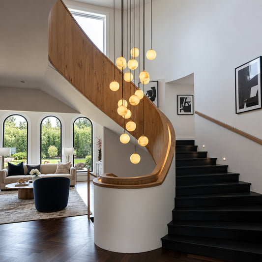 Grappolo alabaster cluster chandelier with cascading natural alabaster globes in a spiral staircase