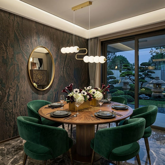 Halia pearl ring chandelier above round dining table elegant warm glow modern interior