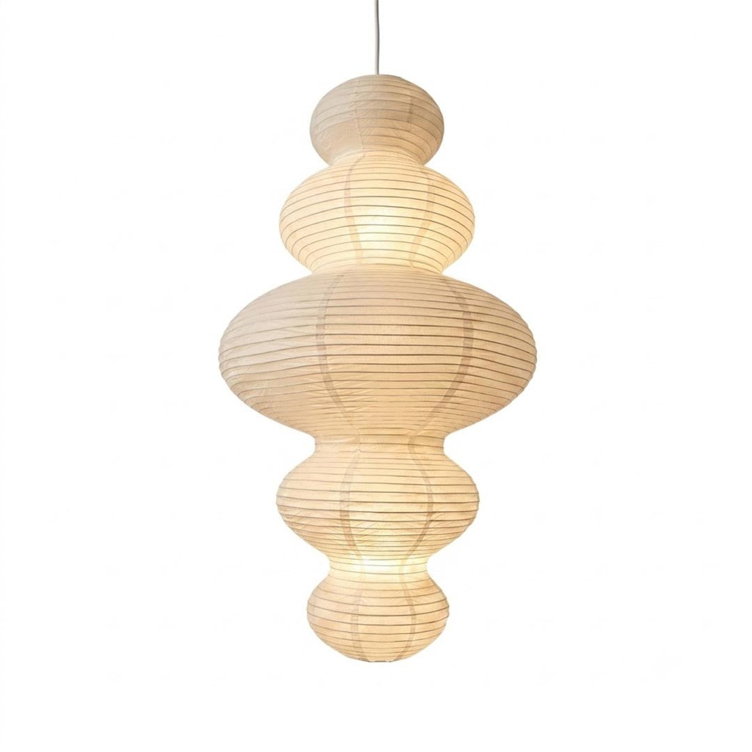 Stuber Lighting Japandi style rice paper pendant lamp with a multi-tiered ribbed lantern silhouette, perfect for Wabi-Sabi and minimalist organic modern interior designs.