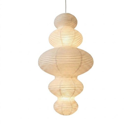Stuber Lighting Japandi style rice paper pendant lamp with a multi-tiered ribbed lantern silhouette, perfect for Wabi-Sabi and minimalist organic modern interior designs.