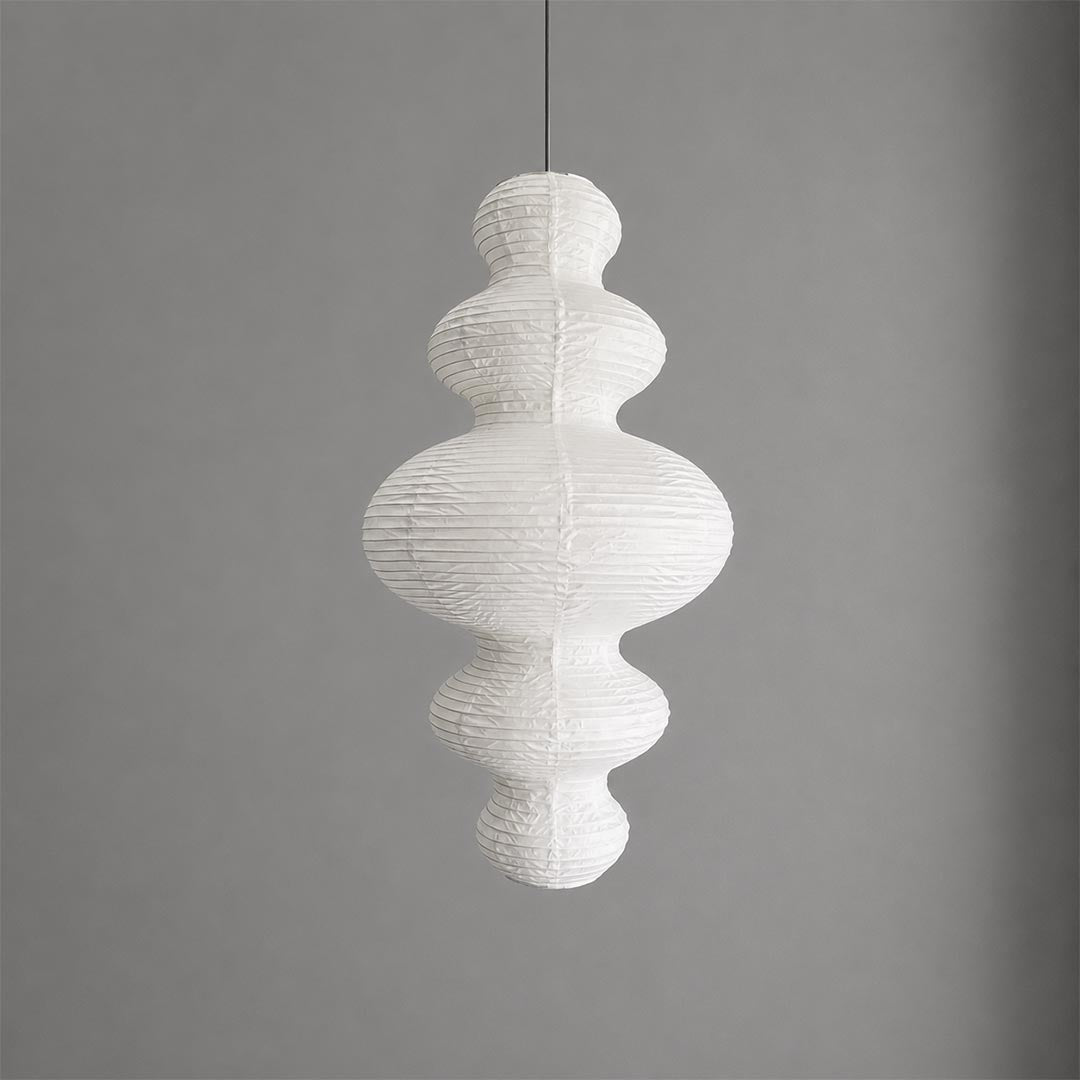 Studio shot of the Stuber Lighting multi-tier bubble shaped rice paper pendant lamp against a neutral gray background, highlighting its unique silhouette.