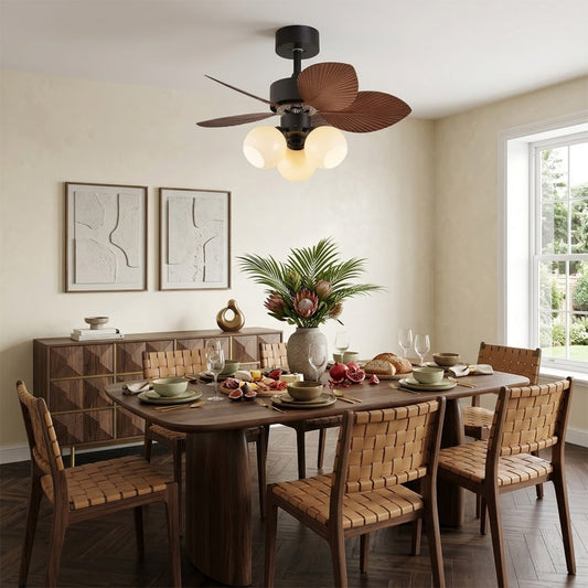 Lotus vintage ceiling fan with light above bed warm glass shade glow bedroom interior