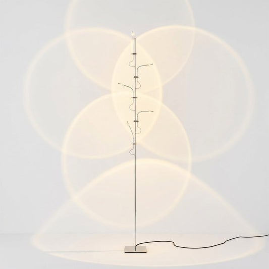 Lumi cordless slim floor lamp 62 inch chrome base transparent glass tube integrated LED minimalist white background