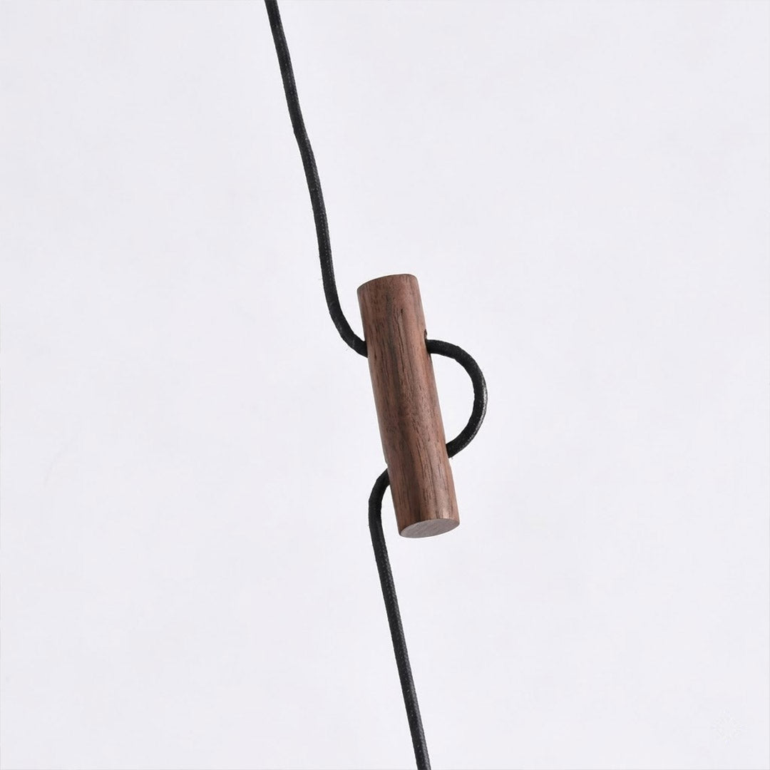 Mochi pendant hemispherical wood shade brass stem frosted glass diffuser close up Japanese minimalist craftsmanship detail