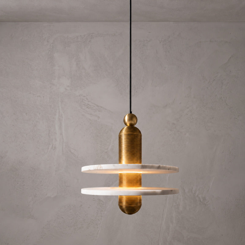 Double-disc 11-inch gold Saturno alabaster pendant as a statement over a dining table