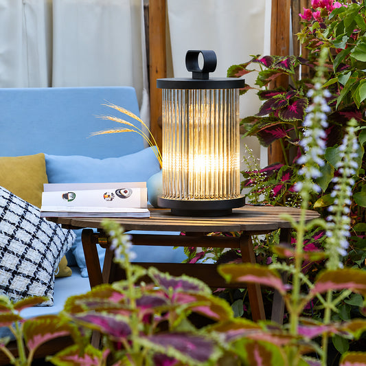 Row of Torre outdoor garden lights lighting a restaurant garden terrace at night