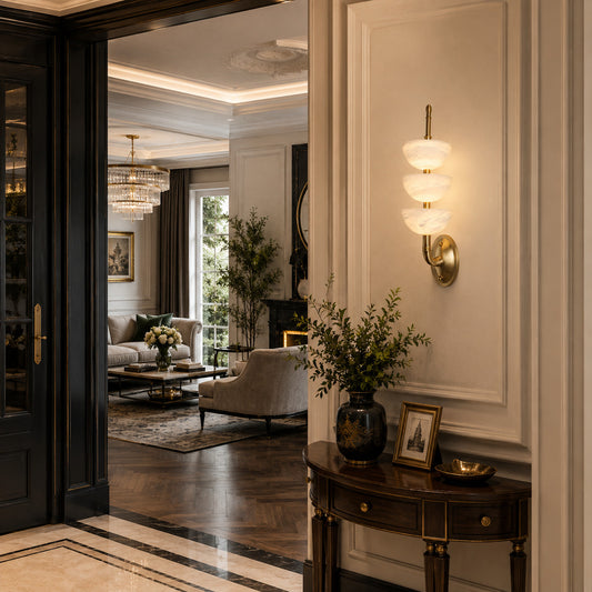 Trio alabaster wall sconce welcoming guests with a warm glow above an entry console