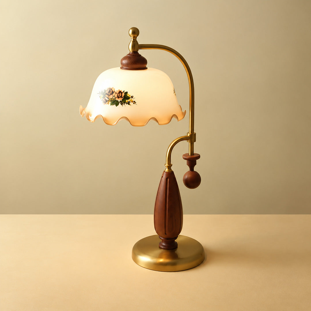 Model D Volant vintage table lamp with a scrolled brass arm walnut base and amber textured ruffled glass shade