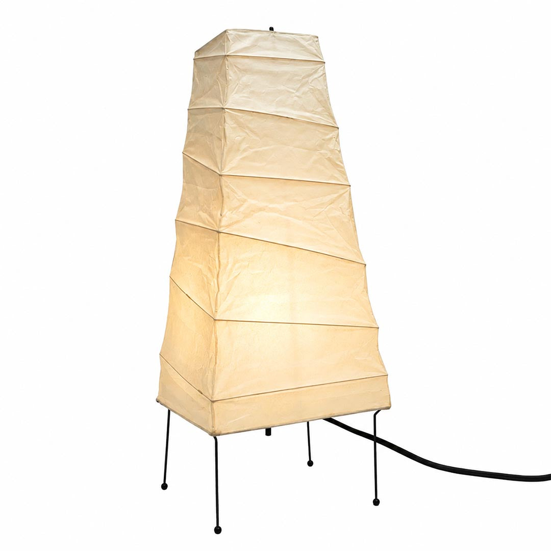 Illuminated tapered square Washi Paper 4N Table Lamp with fine metal legs against a white background by Stuber Lighting.