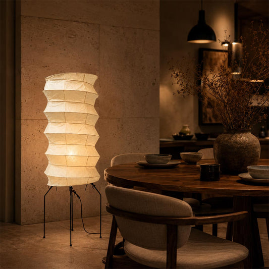 Moody dining room corner beautifully enhanced by a glowing ribbed Washi Paper UF2-31N Lantern Lamp by Stuber Lighting.