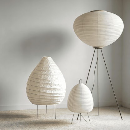 Large 22N Washi paper table lamp with bamboo ribs, glowing warmly on a minimalist floor setting.
