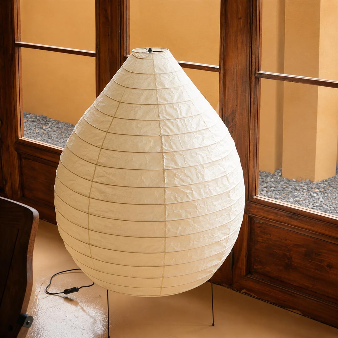 Japandi style 23N washi paper pear shape floor lamp standing near a wooden sliding door