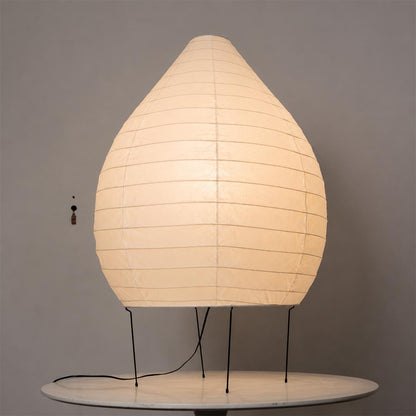 23N washi paper pear shape sculptural floor lamp glowing warmly against a minimalist clean backdrop