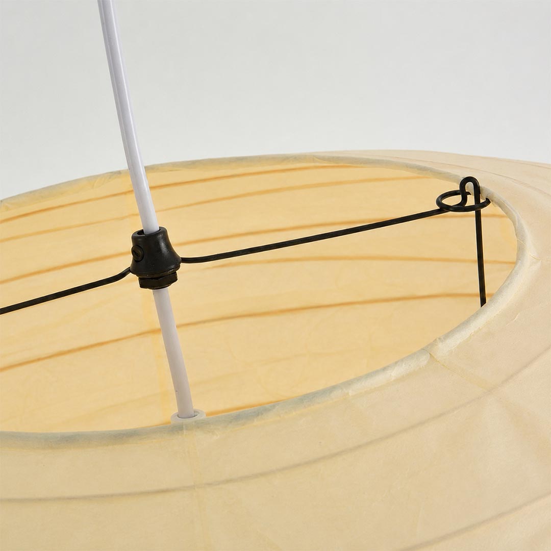 Close-up shot of Stuber Lighting Japanese paper pendant lamp showing the premium handmade rice paper texture and fine ribbed metal framework details.