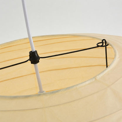 Close-up shot of Stuber Lighting Japanese paper pendant lamp showing the premium handmade rice paper texture and fine ribbed metal framework details.
