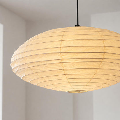 Close-up shot of Stuber Lighting Japanese paper pendant lamp showing the premium handmade rice paper texture and fine ribbed metal framework details.