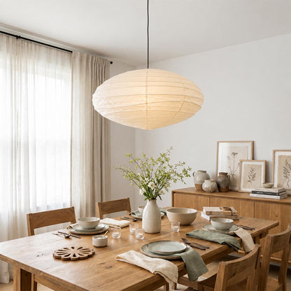 Vintage Wabi-Sabi home interior featuring Stuber Lighting handmade ribbed paper lantern hanging light, organic modern dining and lounge decor with warm earth tones.