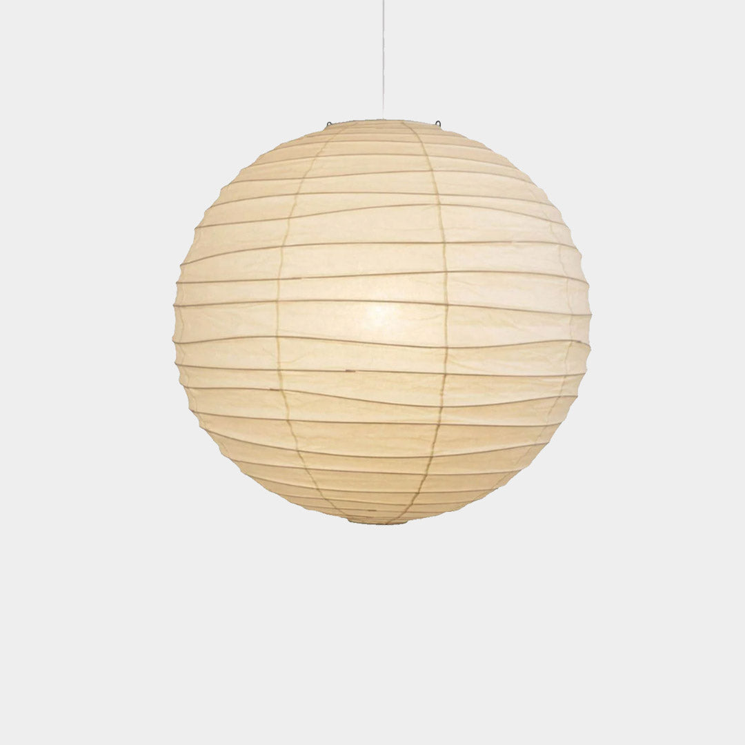 "Stuber handcrafted washi paper sphere pendant light emitting a warm, diffuse glow for minimalist Japandi interiors."