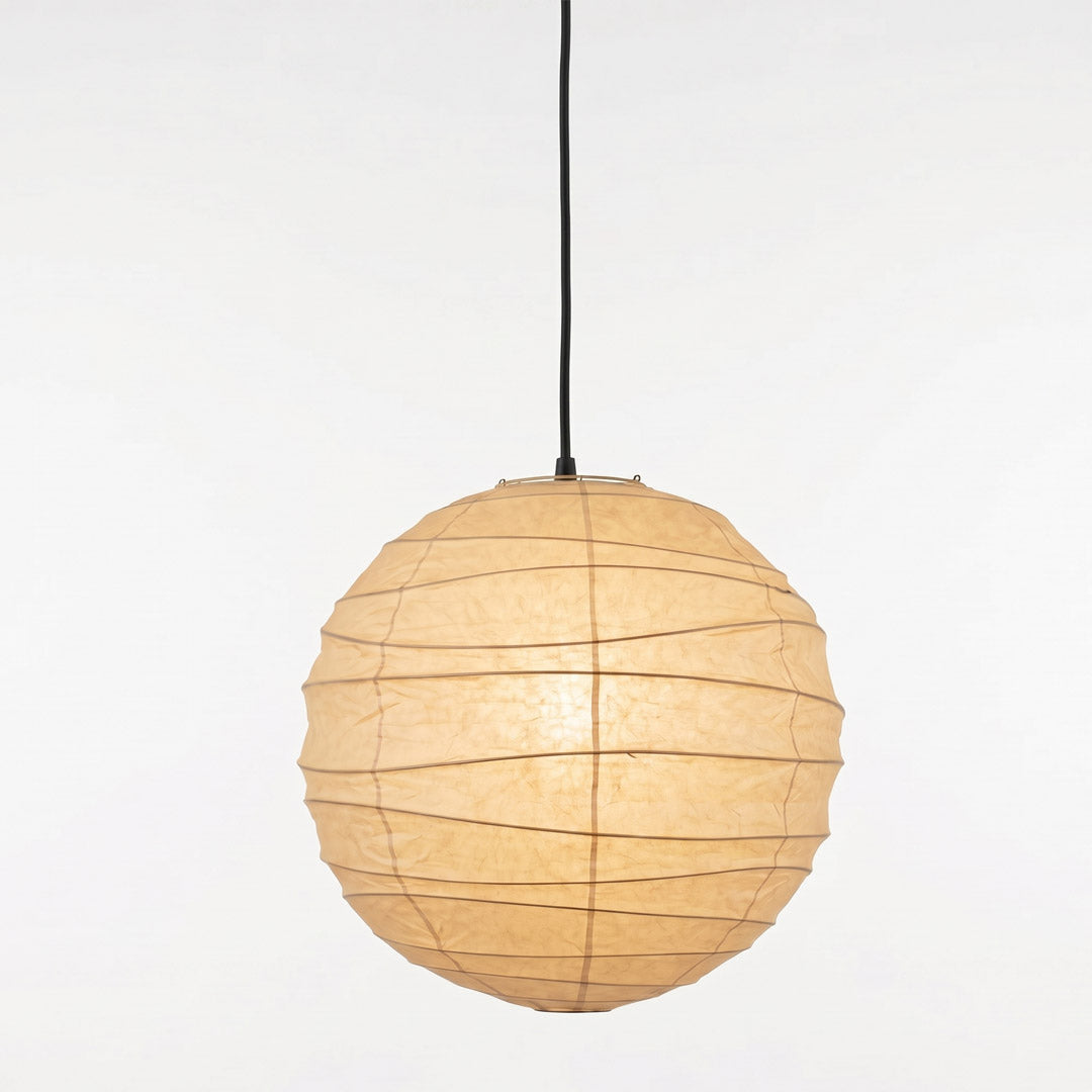 "Stuber handcrafted washi paper sphere pendant light emitting a warm, diffuse glow for minimalist Japandi interiors."