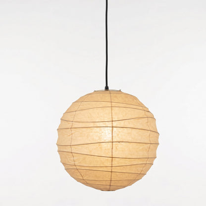 "Stuber handcrafted washi paper sphere pendant light emitting a warm, diffuse glow for minimalist Japandi interiors."