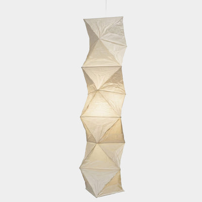 Large Akari L8 style vertical washi paper pendant light, 63 inches tall with accordion folds, emitting a warm ethereal glow.