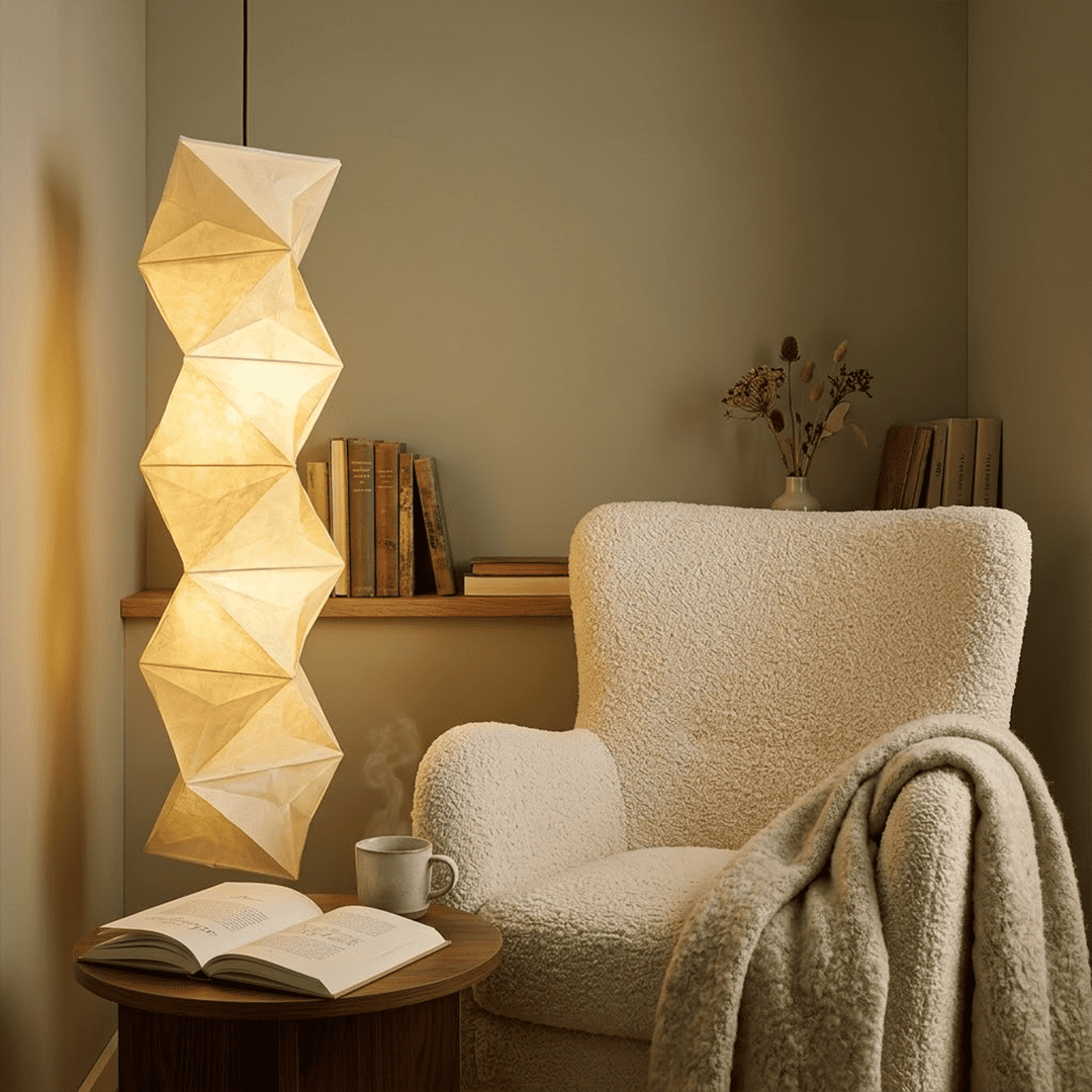 Large Akari L8 style vertical washi paper pendant light, 63 inches tall with accordion folds, emitting a warm ethereal glow.