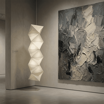 Large Akari L8 style vertical washi paper pendant light, 63 inches tall with accordion folds, emitting a warm ethereal glow.