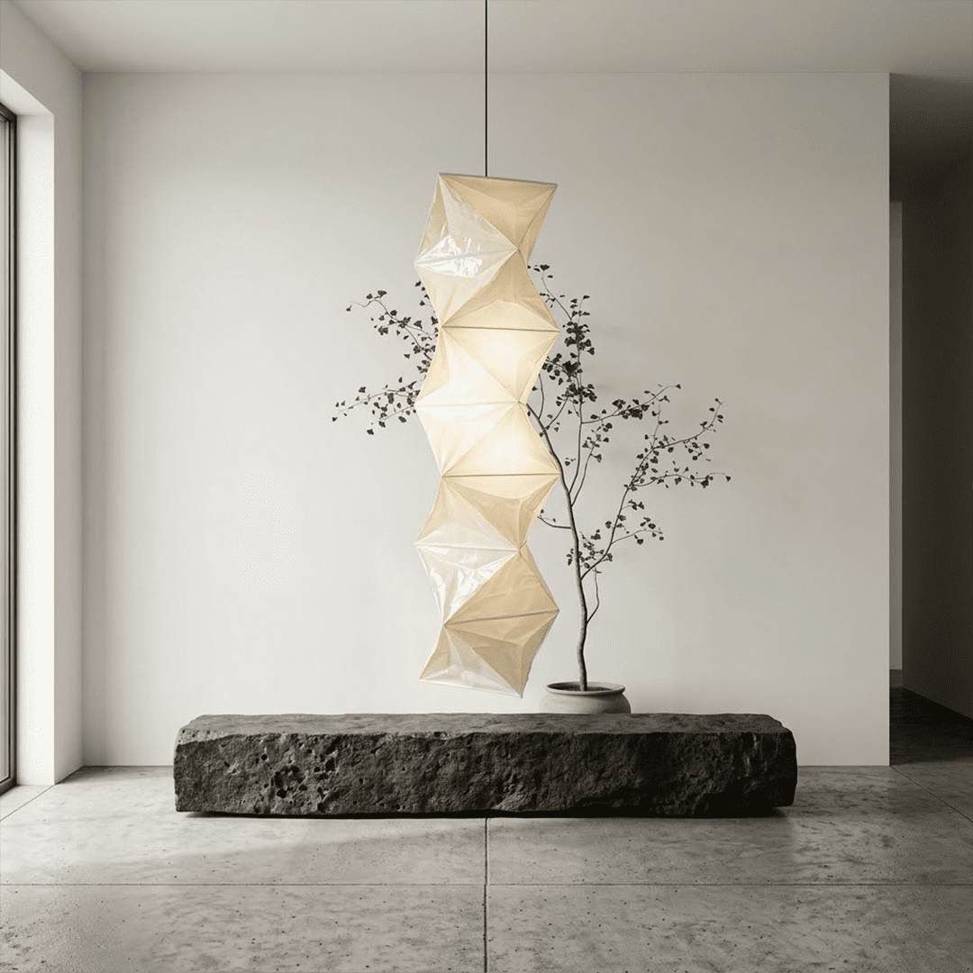 Large Akari L8 style vertical washi paper pendant light, 63 inches tall with accordion folds, emitting a warm ethereal glow.