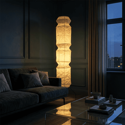 Minimalist modern home lamp: A sculptural Japanese-style multi-tiered paper floor lamp with a columnar design, providing warm interior decoration lighting for a cozy atmosphere.