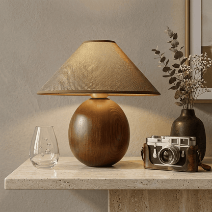Penna wood table lamp switched on warm light glow bedside nightstand