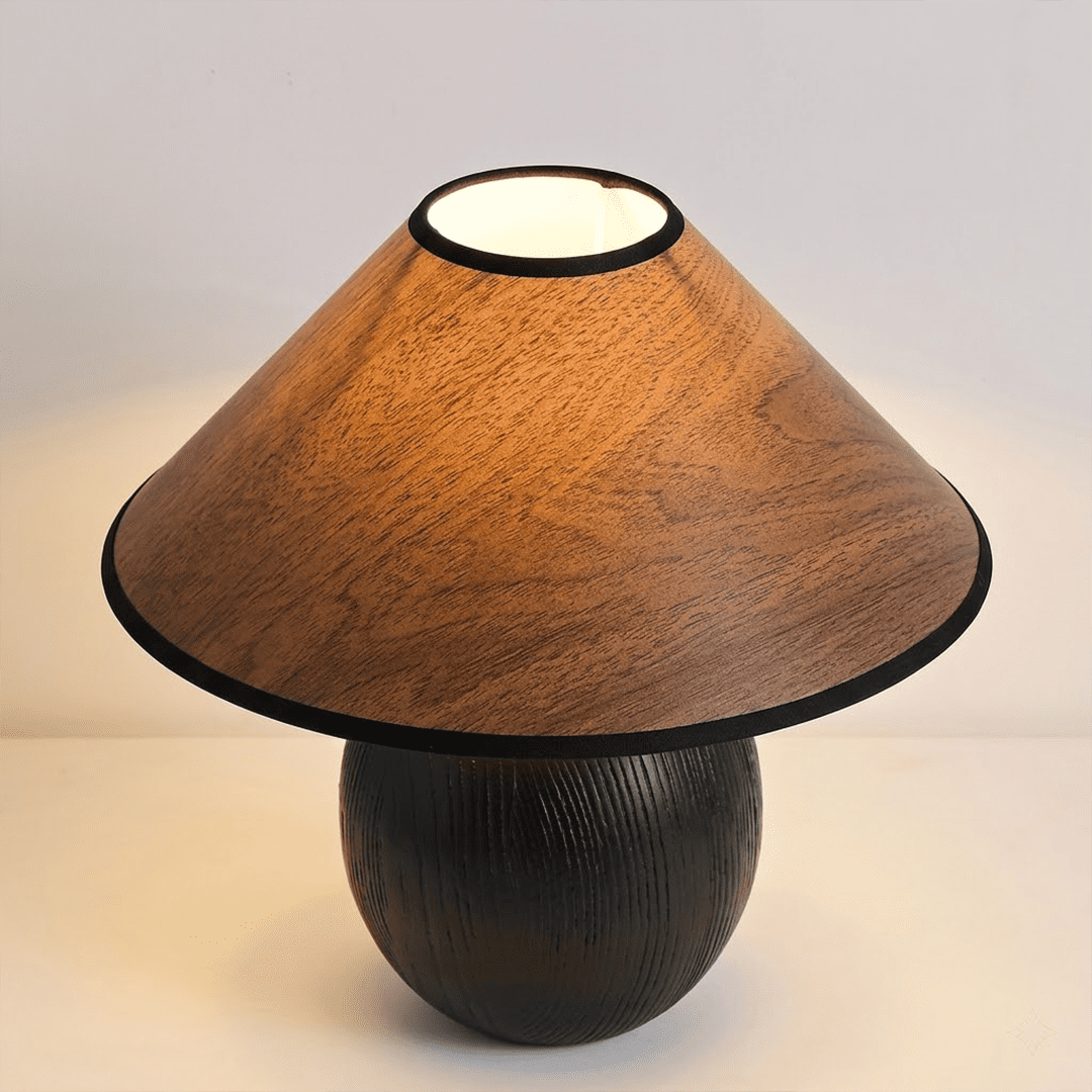 Penna wood table lamp switched on warm light glow bedside nightstand