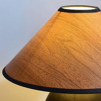 Penna wood table lamp switched on warm light glow bedside nightstand