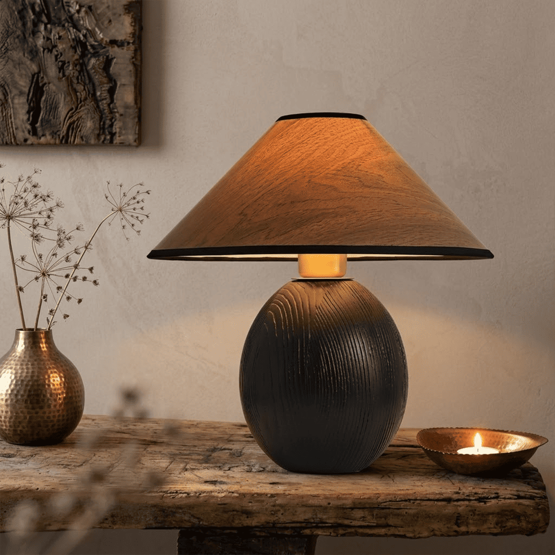 Penna wood table lamp switched on warm light glow bedside nightstand