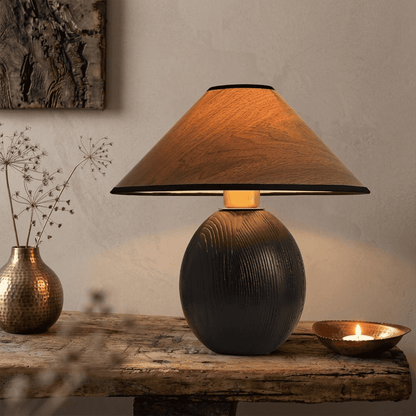 Penna wood table lamp switched on warm light glow bedside nightstand