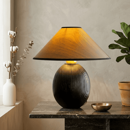 Penna wood table lamp switched on warm light glow bedside nightstand