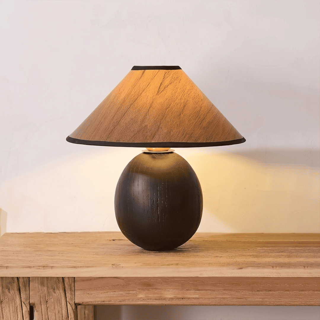 Penna wood table lamp switched on warm light glow bedside nightstand