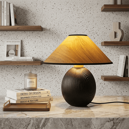 Penna wood table lamp switched on warm light glow bedside nightstand