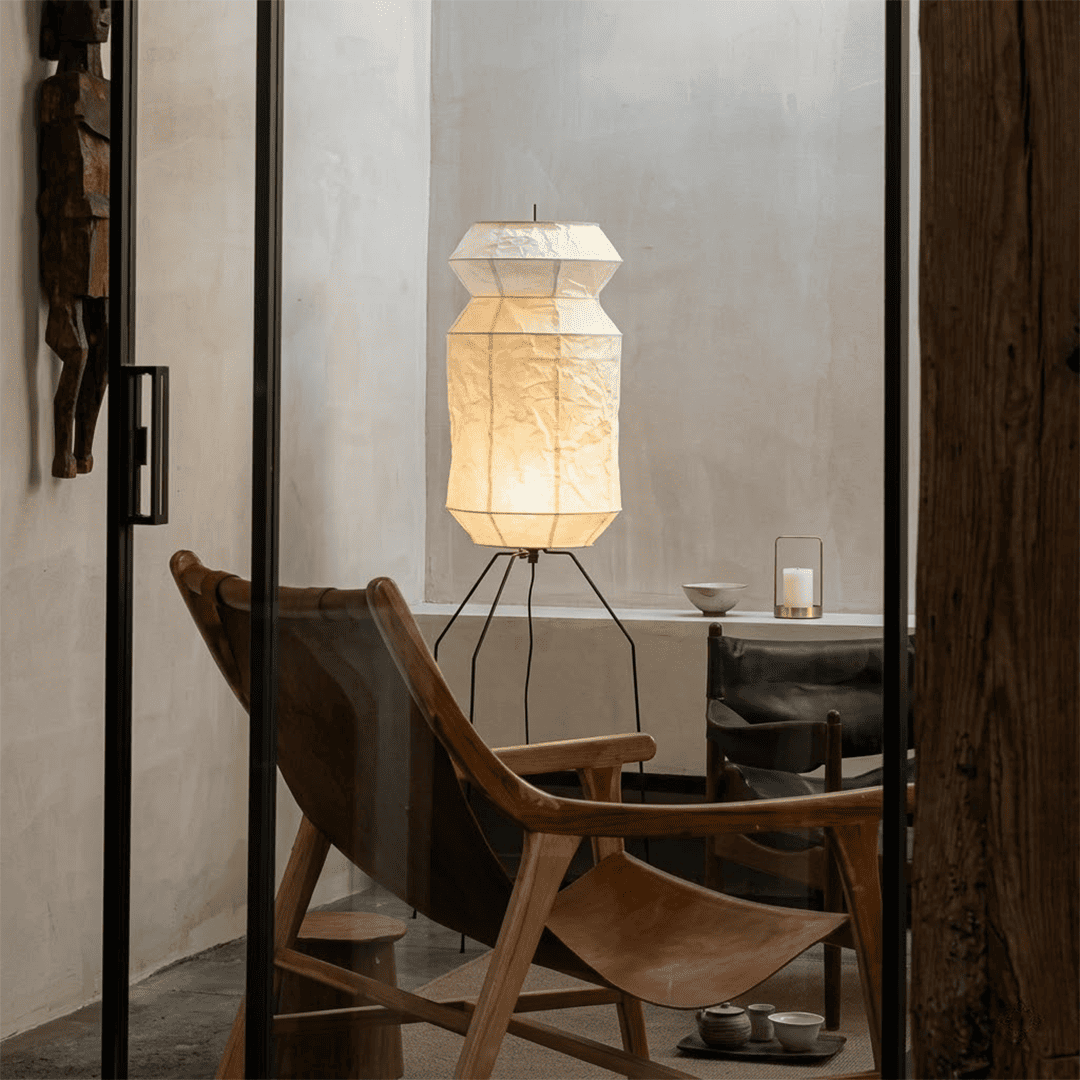 Stuberlighting UF3-L6 handmade Washi paper floor lamp with three-legged metal stand in a minimalist Japandi living room.