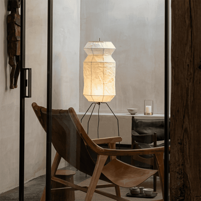 Stuberlighting UF3-L6 handmade Washi paper floor lamp with three-legged metal stand in a minimalist Japandi living room.