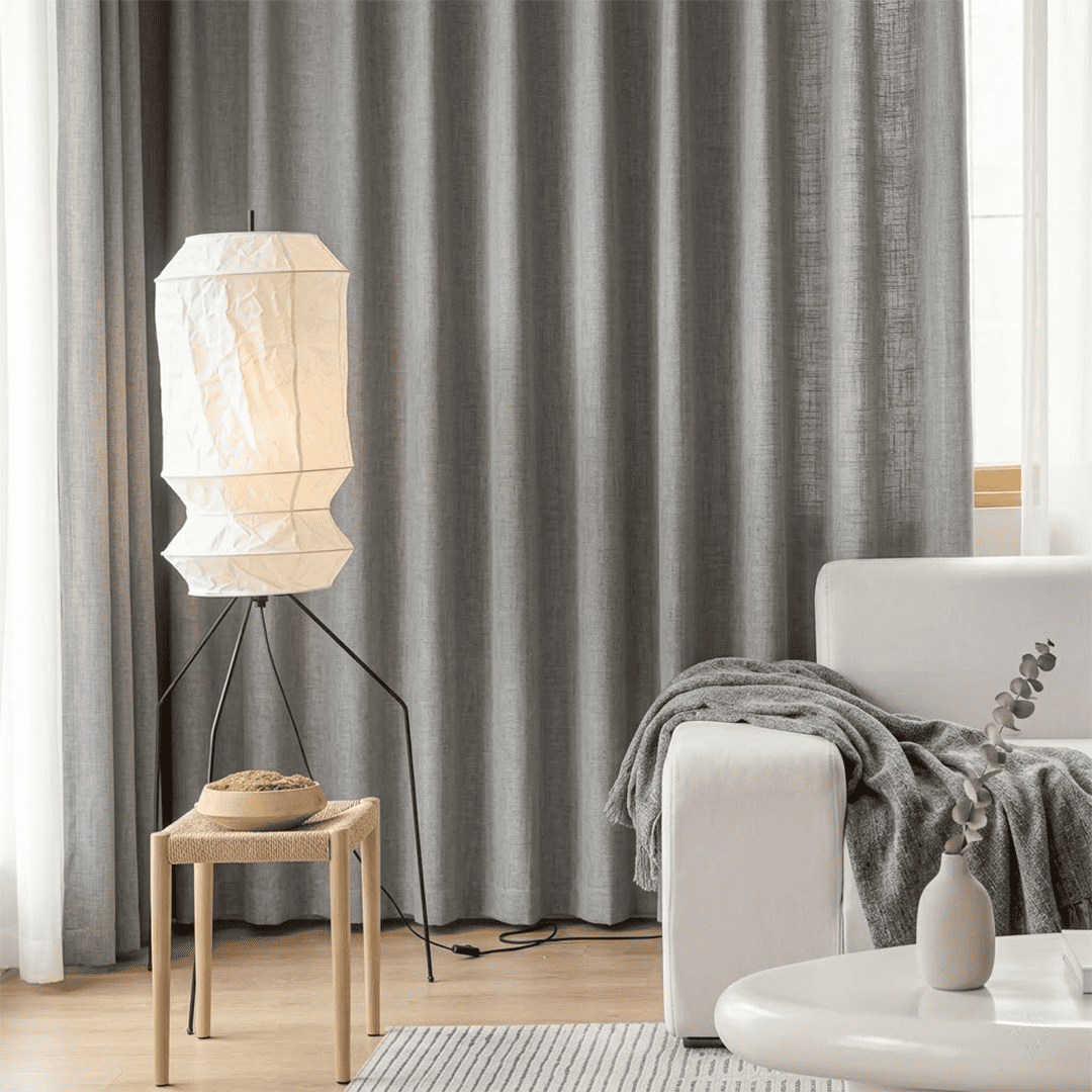 Stuberlighting UF3-L6 handmade Washi paper floor lamp with three-legged metal stand in a minimalist Japandi living room.