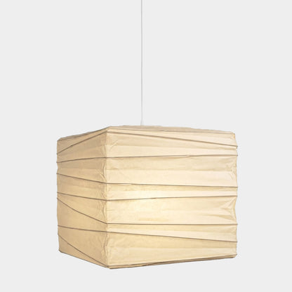 A handcrafted, square Washi paper pendant lamp (Model 33X)—suspended within a room—exudes an innate artistic flair, showcasing the distinctive texture and grain of mulberry bark paper.