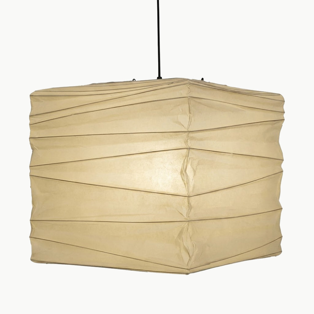 A handcrafted, square Washi paper pendant lamp (Model 33X)—suspended within a room—exudes an innate artistic flair, showcasing the distinctive texture and grain of mulberry bark paper.