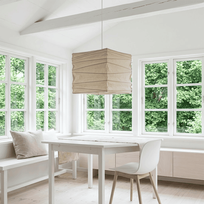 Modern Japanese-style square washi paper pendant light with fine horizontal pleated texture, emitting warm ambient glow through translucent paper for dining room, bedroom, and study.