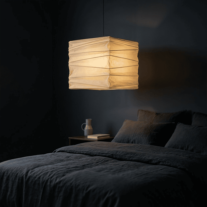 A handcrafted, square Washi paper pendant lamp (Model 33X)—suspended within a room—exudes an innate artistic flair, showcasing the distinctive texture and grain of mulberry bark paper.